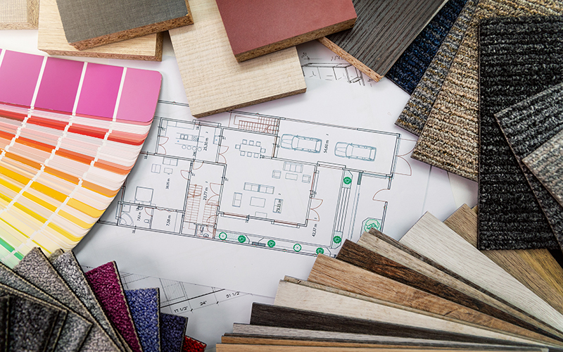 interior design materials and color samples with floor plan blueprint