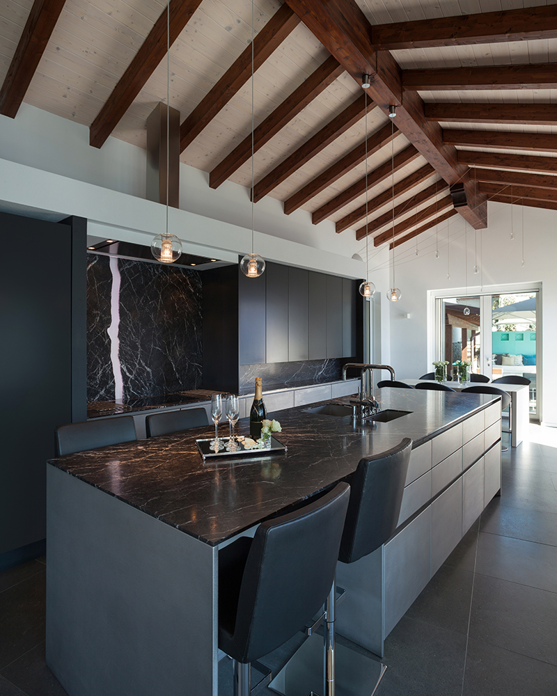 Interior of a loft, kitchen with marble counter top, modern design